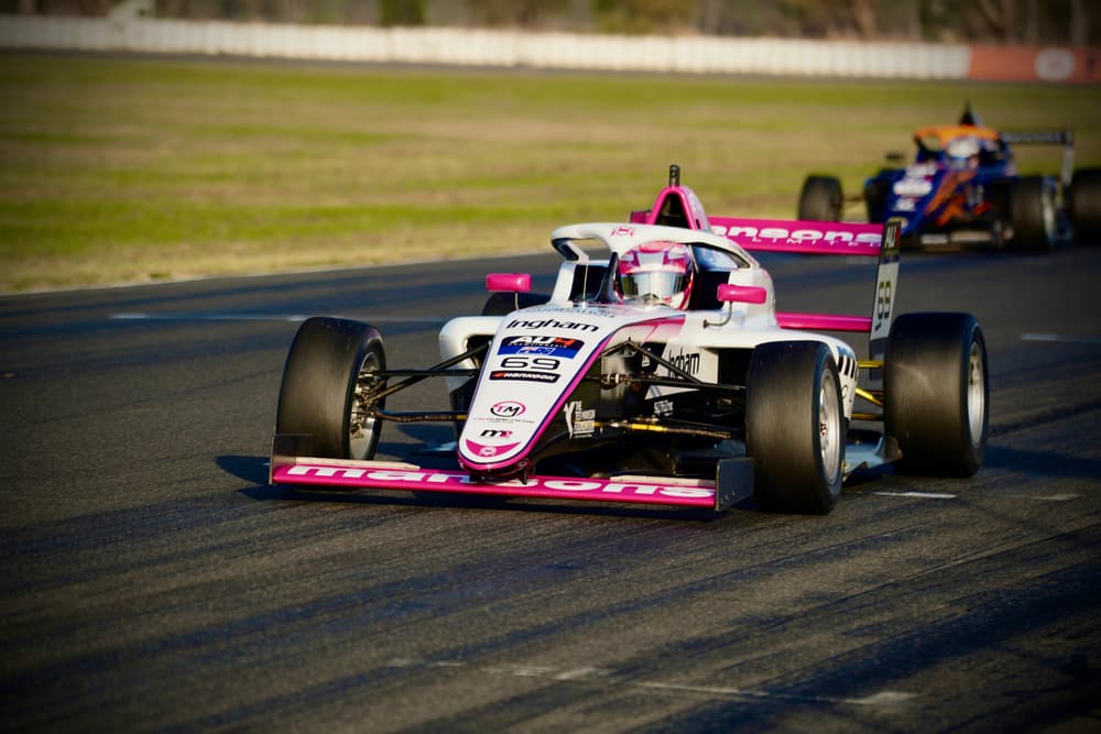 Two formula cars in close battle