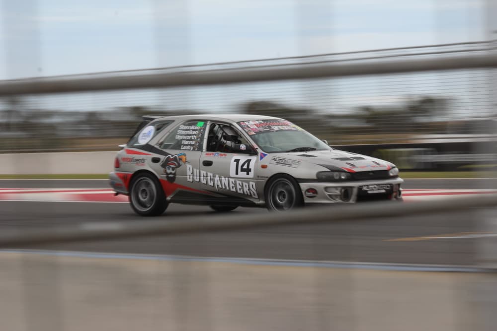 Number 14 hatch race car panning shot