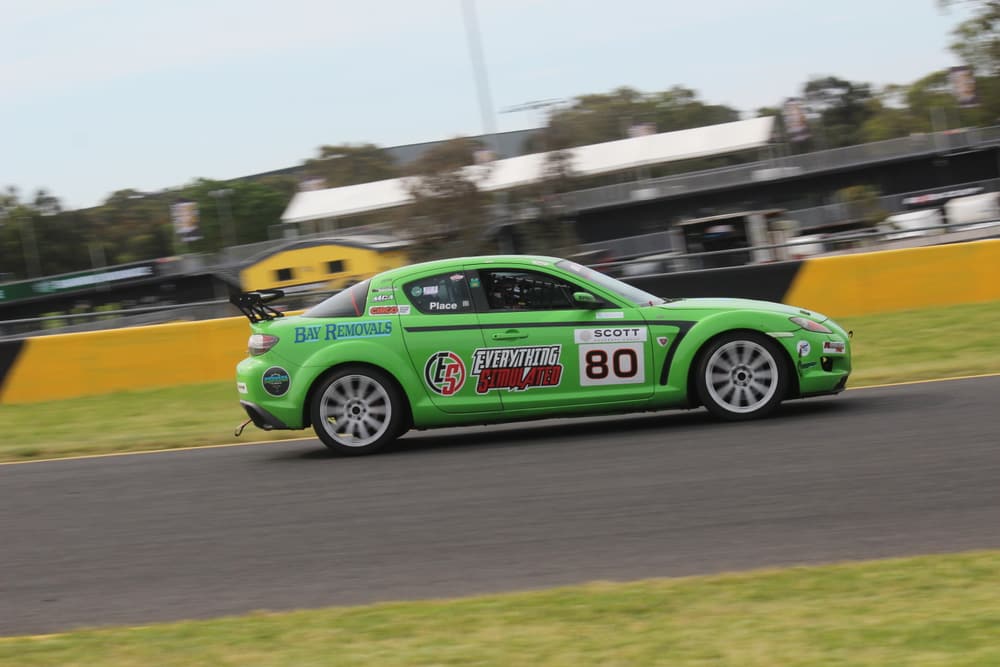 Green Mazda race car on circuit