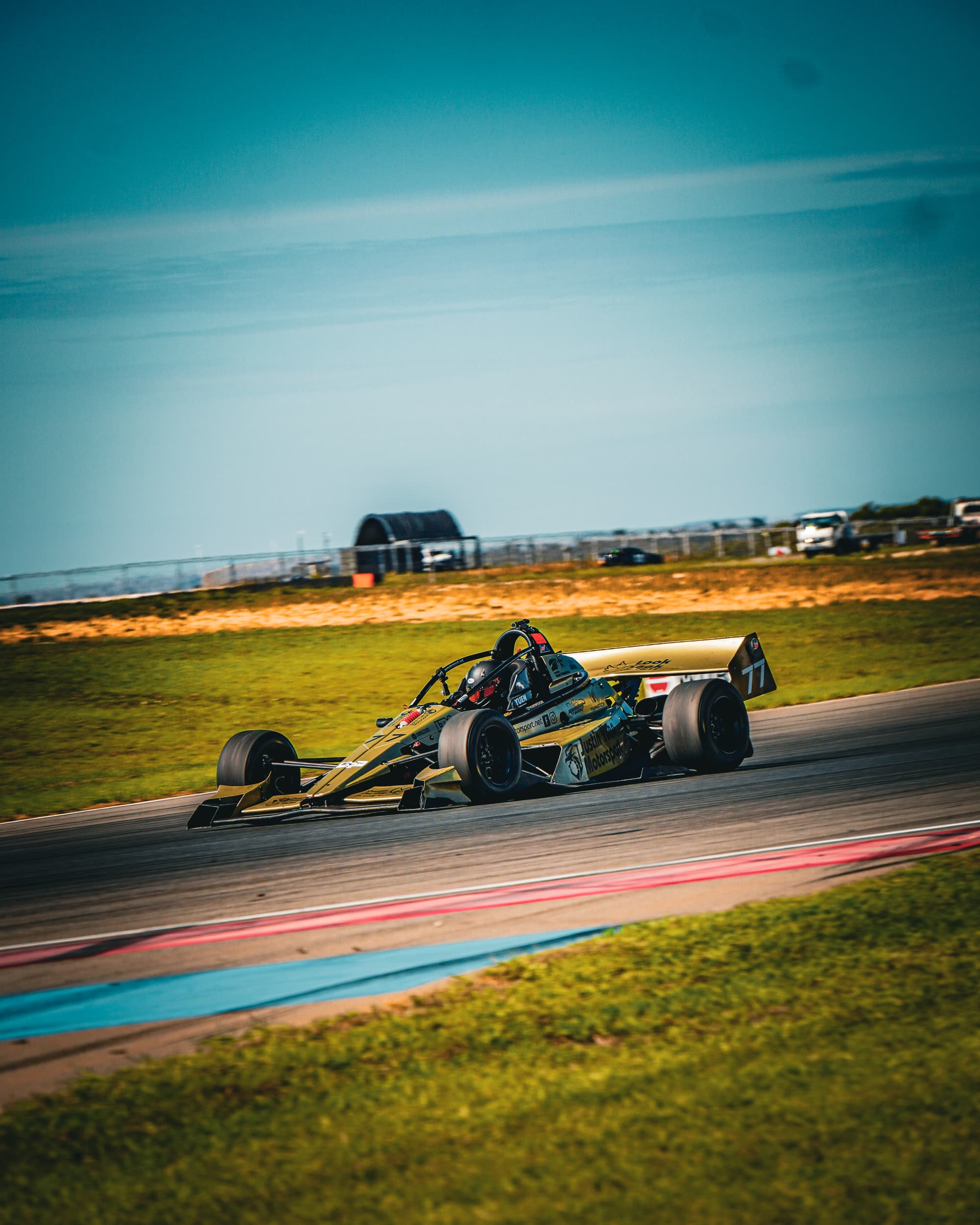 Open wheeler on track in golden evening light