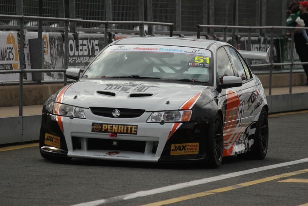 Race car leaving pit lane