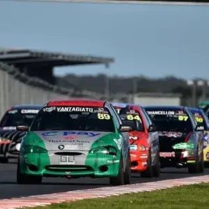 Slipstream Excel leading a pack of Hyundai Excel race cars